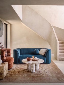 The Fitzrovia 2 Seater in Matt Velvet Navy Mix with Dark Wood Trim, £899. The Fitzrovia Accent Swivel Chair in Luxury Chenille Rust All Over Without Trim, £729